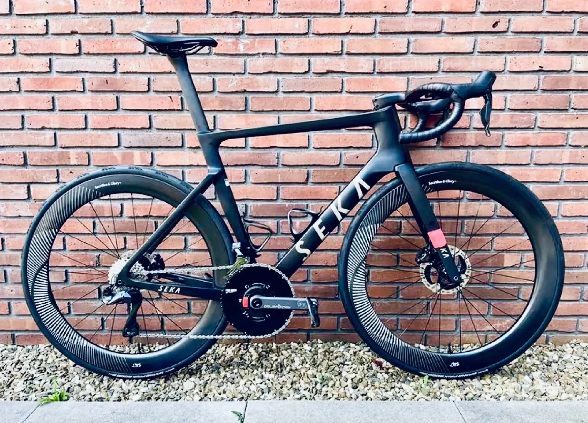 Road bike with custom hand-built deep-section carbon wheels